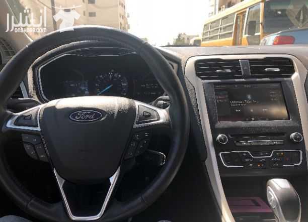 سياره للبيع فورد فيوجن موديل ٢٠١٦ انيرجي هايبرد بحاله جيده المسافه المقطوعه ٢٠ الف ميل الاضافات فل ناقص فتحه السقف فحص ٤ جيد لون السياره فيراني داخل جلد اسود المراجعه الاتصال على الرقم 0785014455