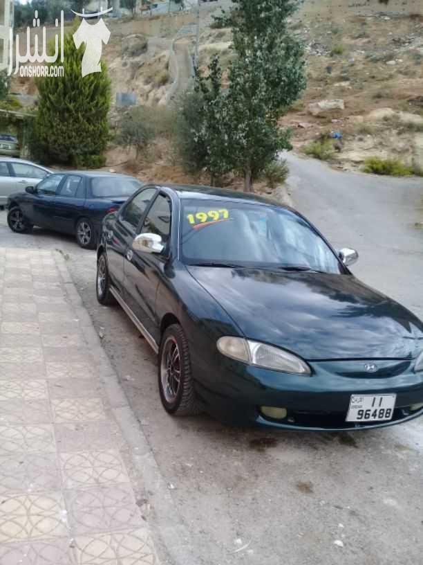 هيونداي افانتي موديل 1997 اللون أخضر زيتي  جير اتومتك ماتور 1500 انجكشن قوي واقتصادي  الفحص :. امامي  :  جيد ،  مضروب أمام العجل  خلفي   : جيد ، جيد بور كندشن شغال ميه بالميه سنتر لوك مع ريموت فورمايك...