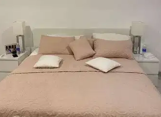King size bed with storage drawers and side tables and side lamps

King size bed with storage drawers and side tables and side lamps for sale in good condition